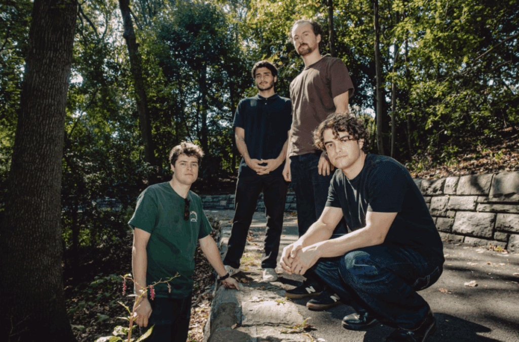 Brooklyn band Local Weatherman stand against a stormy skyline as frontman Fritz Ortman grips the mic mid-shout—capturing the energy and emotional release of their new single “Thread,” from the forthcoming EP Right One.
